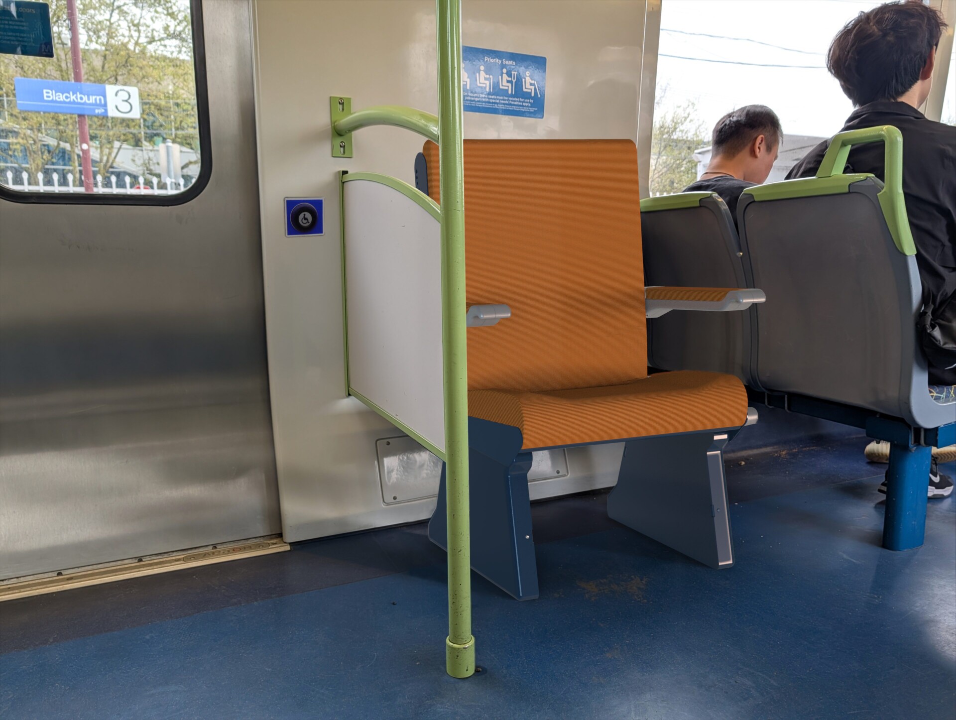 A chair prototype superimposed in a tram priority seating area to simulate how it might fit the space.